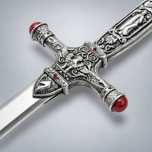 Gryffindor sword crossguard detail with engraved eagle motif and ruby gemstones